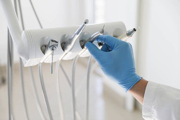 Professional Tooth Extraction technician working in Brentwood, CA